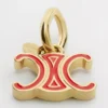 CELINE Charms Triomphe, Emaye ve Pirinç, Altın Kaplama CELINE Charms Triomphe, Emaye ve Pirinç, Altın Kaplama