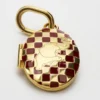 Charms Elephant Locket, altın kaplama pirinç, emaye ve çelik Charms Elephant Locket, altın kaplama pirinç, emaye ve çelik