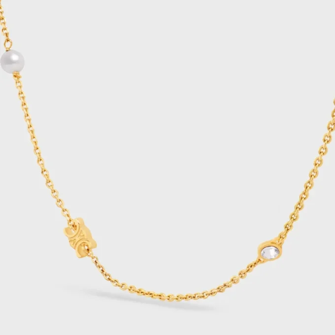 Les Perles CELINE Strass, Reçine İnciler ve Altın Kaplamalı Pirinçten Yapılmış Kolye Les Perles CELINE Strass, Reçine İnciler ve Altın Kaplamalı Pirinçten Yapılmış Kolye
